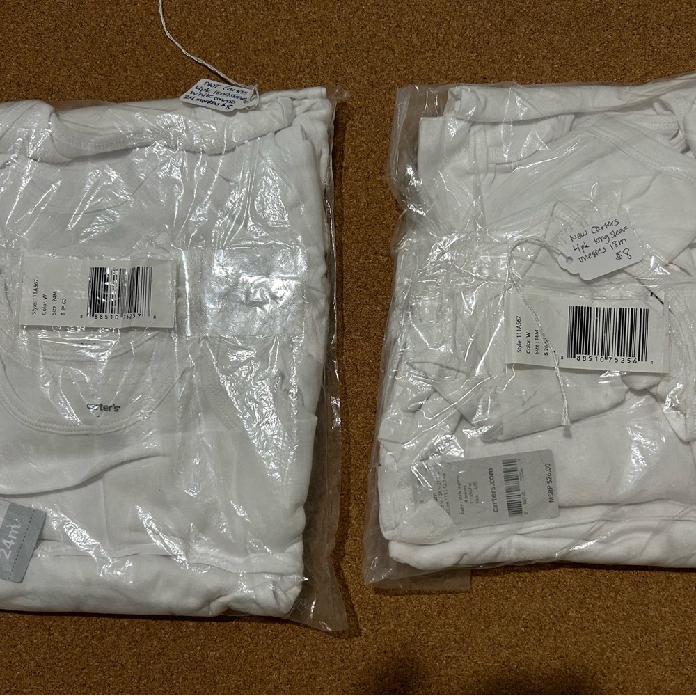 New 2 packs of carters longsleeve white onesies size 18 and 24 months